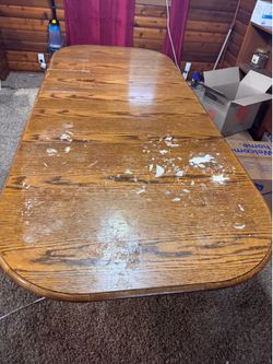 Solid wood dining table with matching chairs