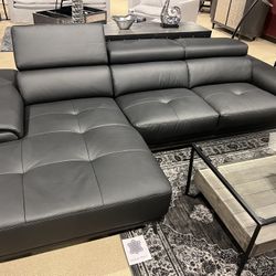 New Sectional W Adjustable Headrests.  Black Leather Match/ Metal Legs.  110x68Dx29H.  Free Delivery!