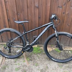 Black Cannondale Catalyst 27.5 Mountain Bike frame size small. like new barely used it just sits in the garage everything works perfectly . Located in