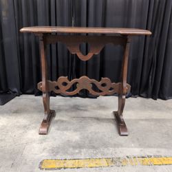 Dark Wood Trestle Console Table with Carved Stretcher