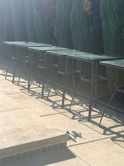 Six black high bar glass tables Six black high bar glass tables