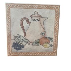 Vintage 8” Ceramic Trivet  cork-board backing features coffee pot with fruit  This vintage 8-inch ceramic trivet with cork-board backing is a unique a