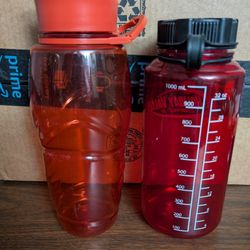 Used.  (2) Large Plastic Water Bottles 32oz For $1 Total