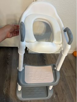 Kids over the toilet potty