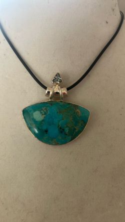.925 blue turquoise Centerstone with light blue topaz upper stone note that pendant sold separately chain not included