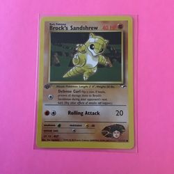 1st Edition Brock’s Sandshrew 71/132 Pokemon Card from Gym Heroes 
