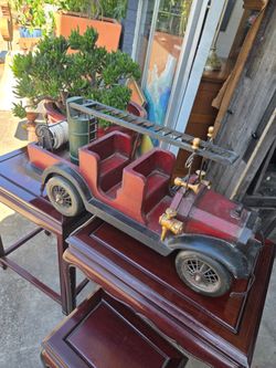 Vintage toy fire truck made of wood and metal, from the 1930s.