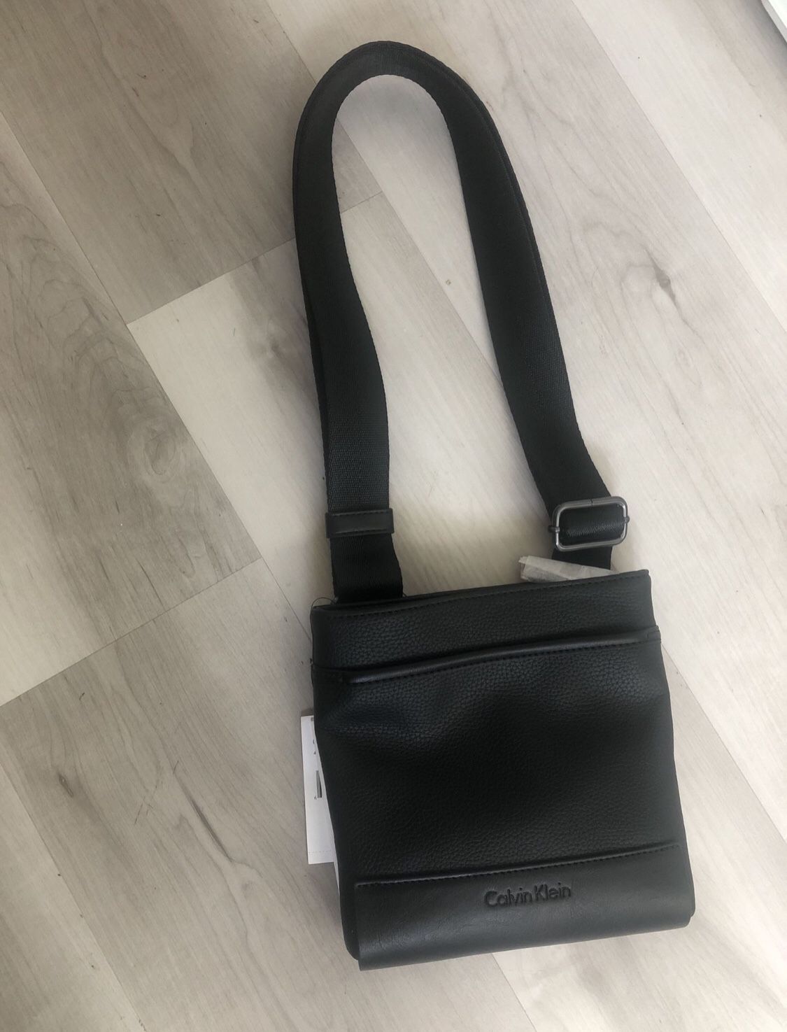 NWT Calvin Klein Men's faux Leather Shoulder Crossbody Mini Messager Bag  Black for Sale in Arcadia, CA - OfferUp