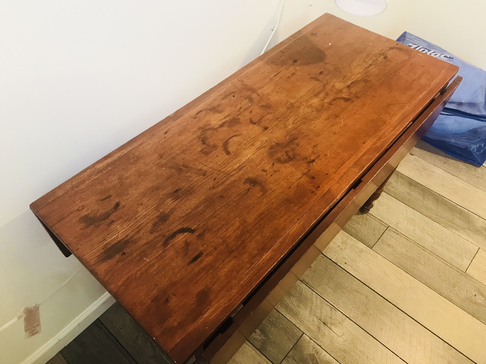 Antique drop leaf table in good condition—-over 150 years old