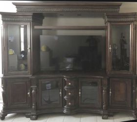 Home entertainment center. From lacks purchased over $4000. Well built. Great condition. Lots of space. Side cabinets and top shelf light up