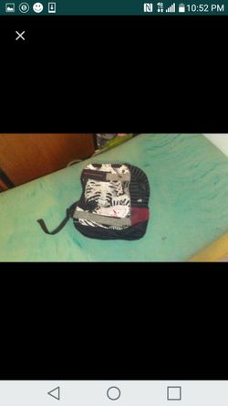 Back pack with skate board holder