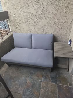 Outdoor loveseat and side table