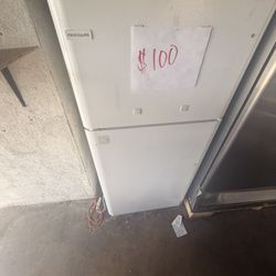 Used Frigidaire refrigerator with a custom-built interior setup