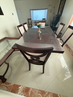 Dining table with glass top and 8 chairs