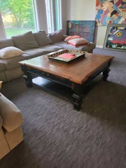 Large of a sectional and coffee table and sofa table