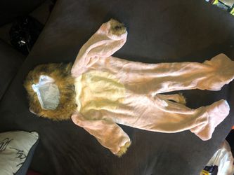 Super cute lion/cowardly lion costume for a baby size 12 to 24 months with detachable head buttons up in the back and add the legs easy for changing!