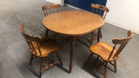 Table and four solid wood chairs very good condition