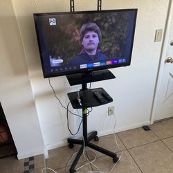 32” tv on portable tv stand for sale