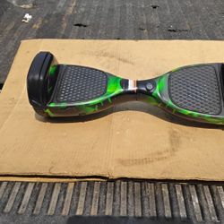 1- Nice Is Electric Skateboard Green In Color Like New. 