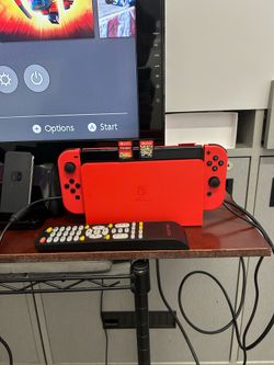 Nintendo switch OLED with games and T.V.