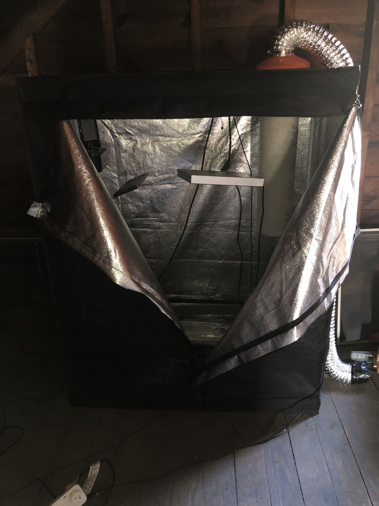 4 by 8 grow tent with 3 300 watt led lights plus a huge carbon filter