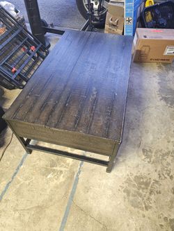 Rustic coffee table with a lift-top mechanism