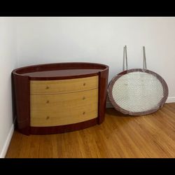 Beautiful vintage dresser with an attached mirror and unique curved design.