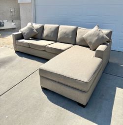 Light Colored Sectional with Sleeper Couch