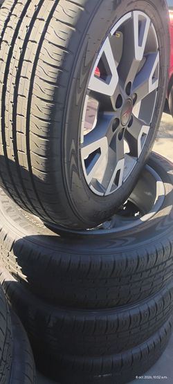 New Toyota rims with nearly new Dunlop brand tires, size 265/55R20