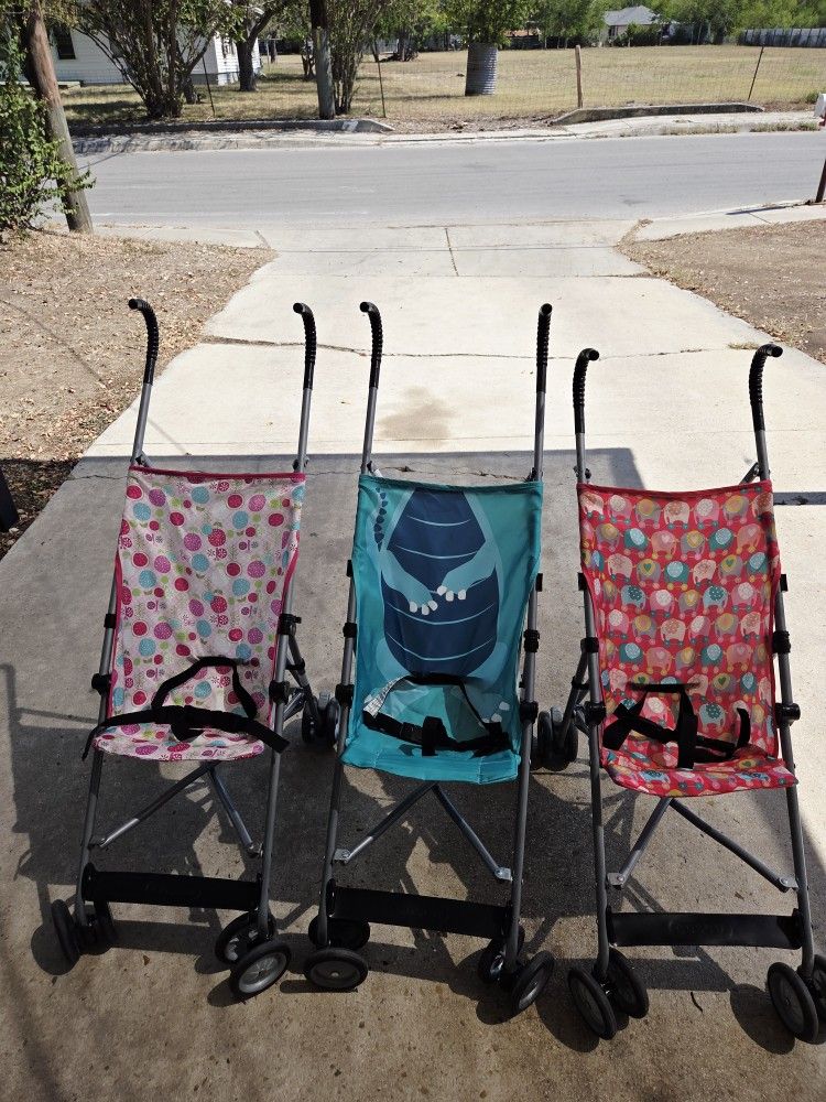 2 Pink Cosco Strollers Available $10 EACH. Blue One Sold