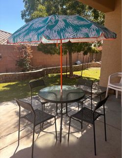 Outdoor set . Table + 4 chairs + matching end table+ umbrella $80 OBO