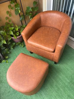 Brown faux leather chair and ottoman