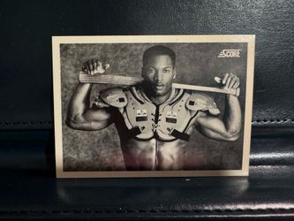 1990 Score #697 Bo Jackson trading card, featuring a black-and-white image of him wearing both baseball and football gear.