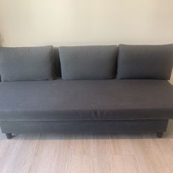 Dark gray used sleeper sofa, looks like new, bought in less than a year.  