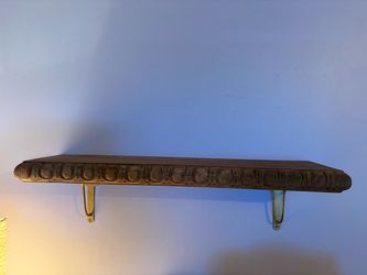 Magnolia wood shelf with brass brackets