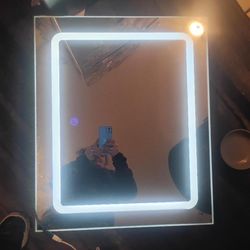 300$ retail 3 light settings in wall mirror $50
