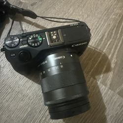 Canon EOS M3 Mirrorless Camera With Zoom Lens And Accessories