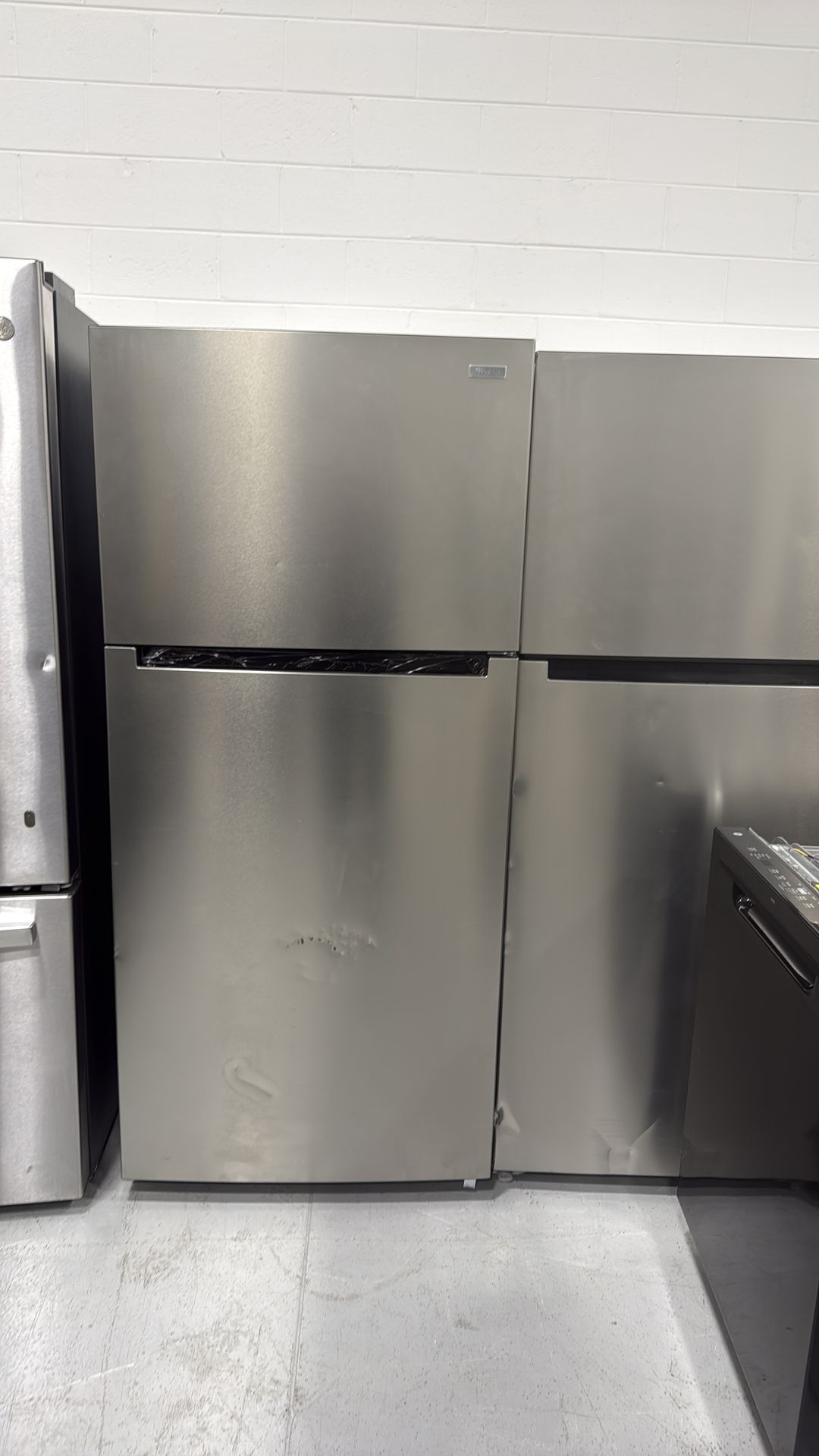 Brand new stainless steel top freezer refrigerator