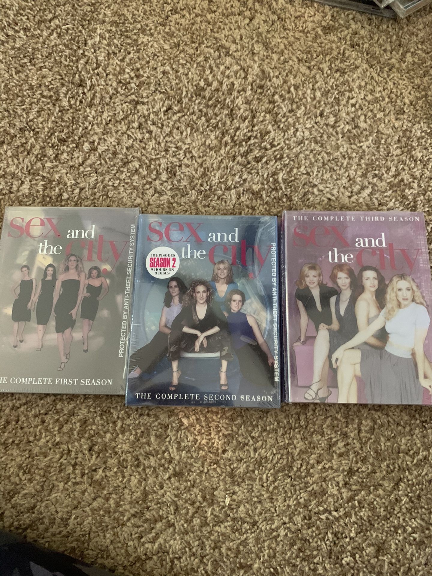 Sex and the city. DVDs of season 1, season 2, and season 3. New in plastic sold as a lot