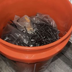 5Gallon bucket filled with nails
