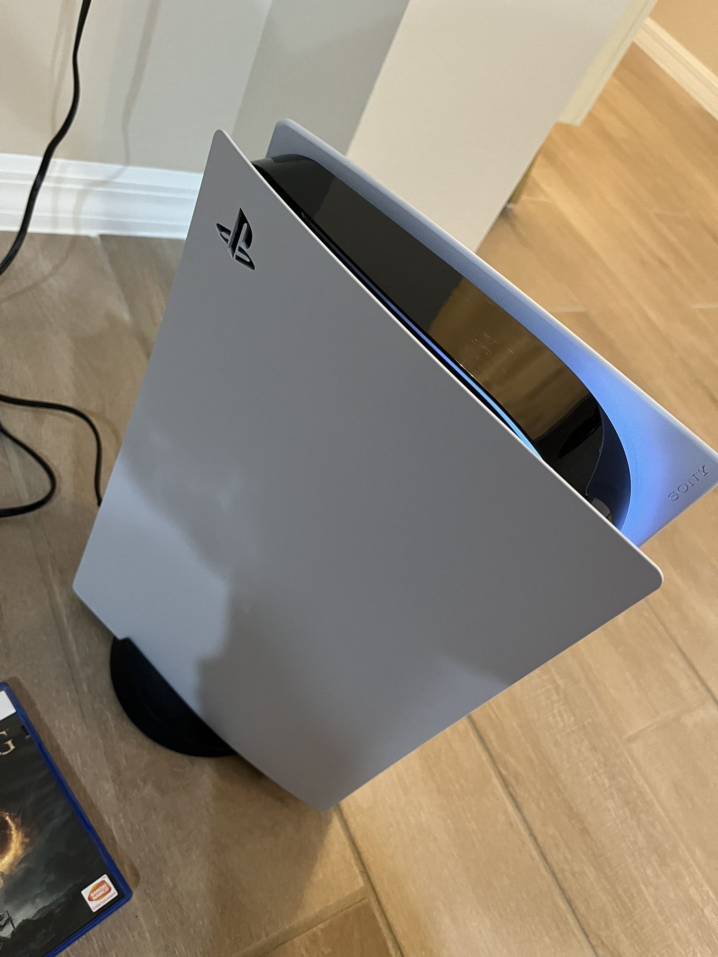 PS5 with Controller and Elden Ring Disc