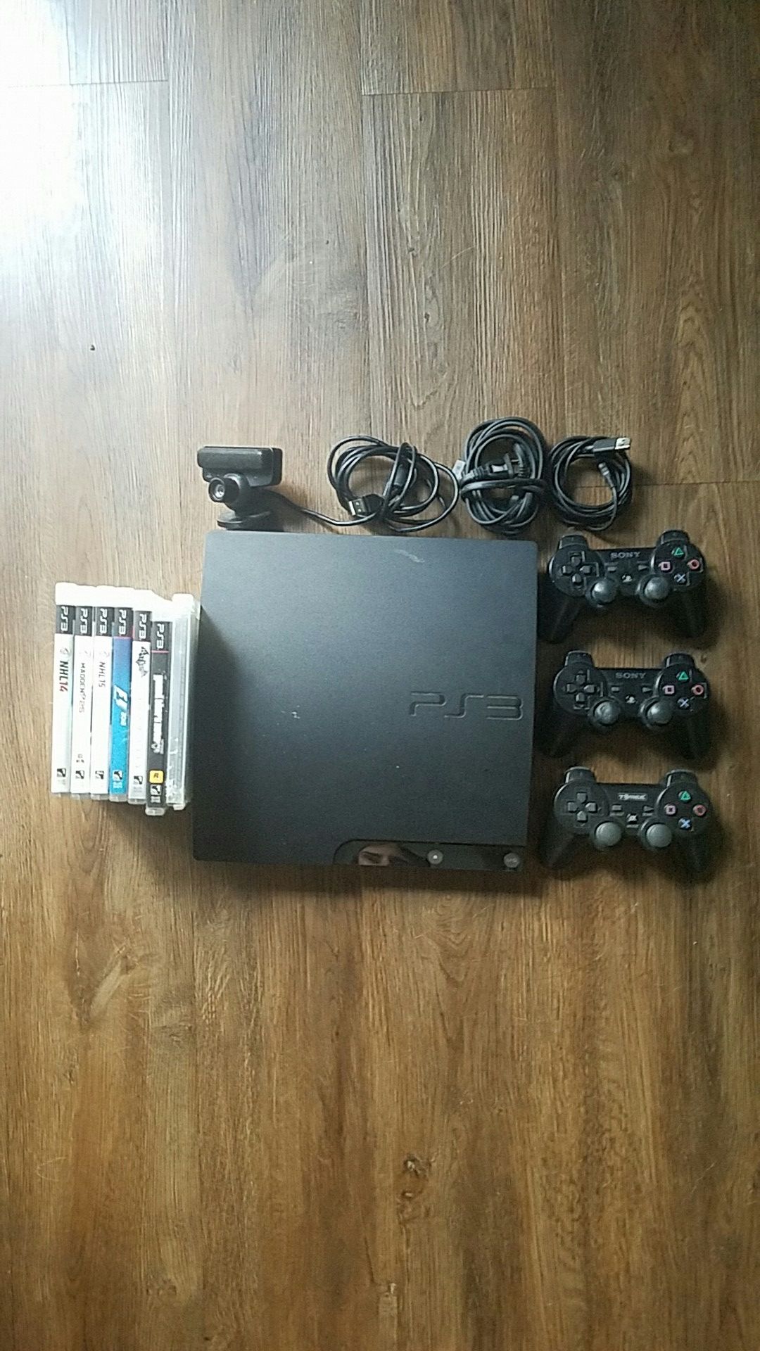 PS3 with 3 controllers and 7 games