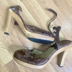 Michael Kors pre-owned (wore 2x) brown leather high heeled wood platform sandals w/ decorative metal stud accents.