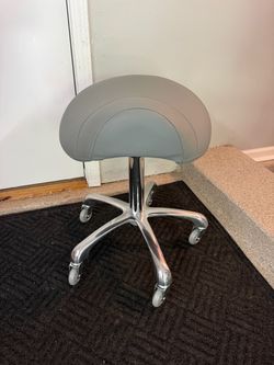Brand New Grey/Chrome Height Adjustable Saddle Stool w/Rollerblade Wheels
