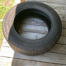 Like new tire no wires, showing good treads