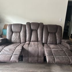 : Stylish Three-Seater Reclining Coffee Couch with Phone Charging Station