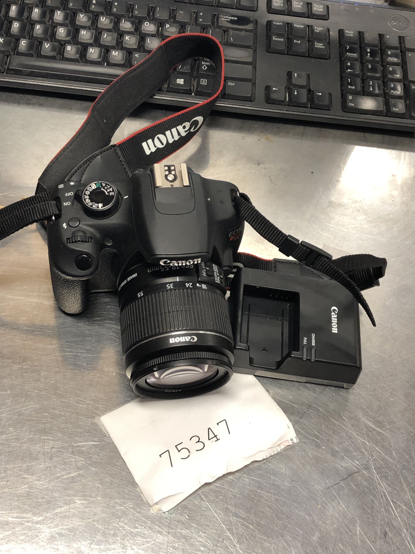 Canon rebel T5 digital camera with the lens and charger