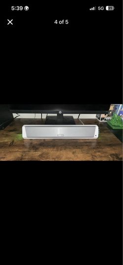 HP X27q gaming monitor with a speaker for the monitor and a steel series headset for the Xbox