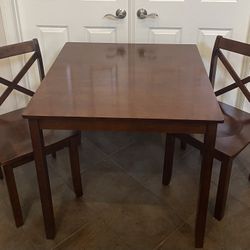 3 pc wood dining room Table And Chairs set.