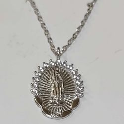 Sterling silver Virgin Mary necklace. The necklace 18" long  